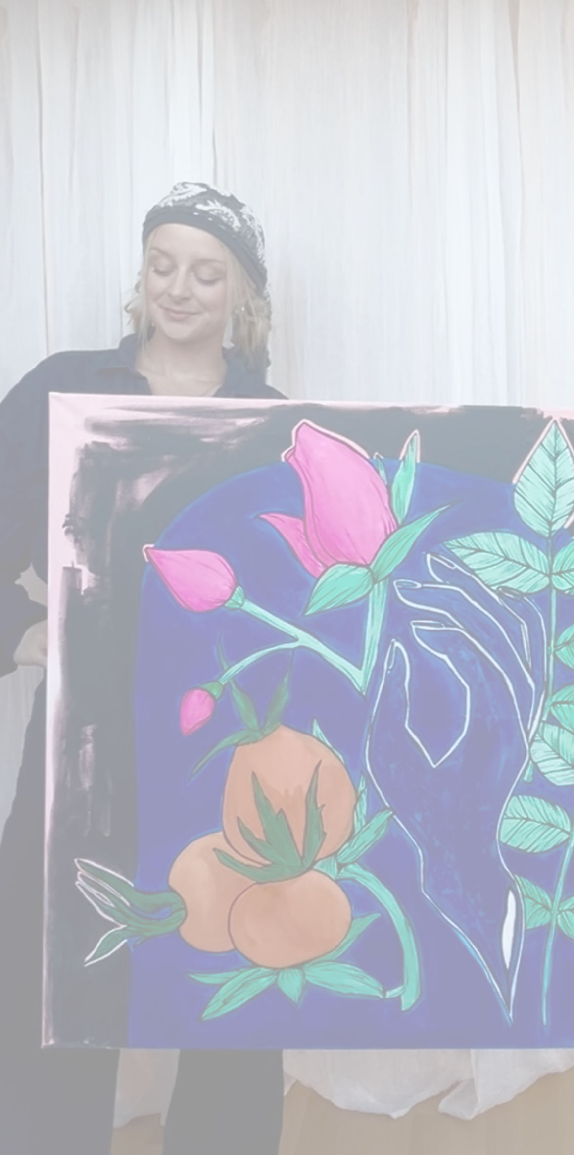 Maria Fallström holding a colorful floral artwork